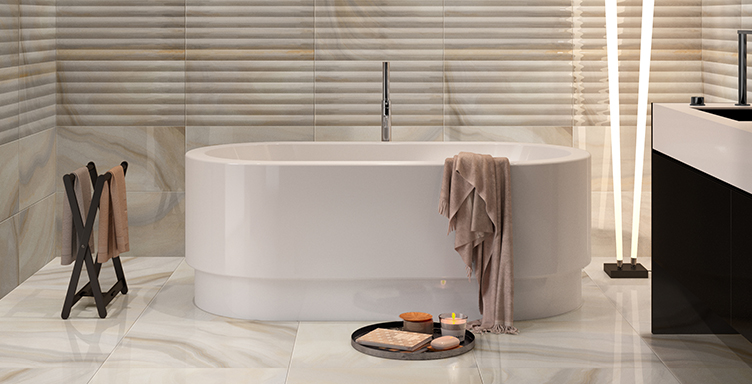VitrA Cocoon free-standing bath with towel draped over side and candle on the floor